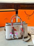 Hermès Taupe Canvas Tote Bag